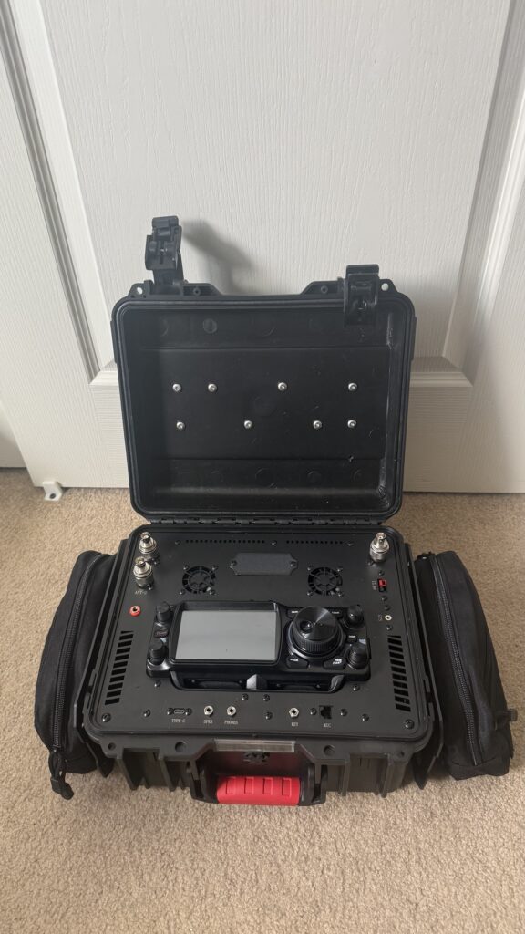Updated Yaesu FTX-1 Optima go-box with the lid open and MOLLE pouches on both sides